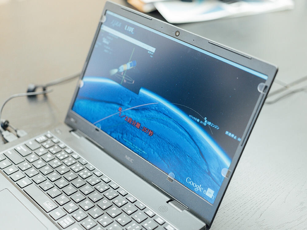 Application displayed during live rocket launch broadcast. Photograph is JAXA's design.