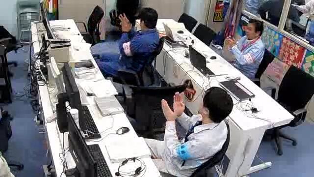 Scene in the control room at the successful launch of Epsilon-4