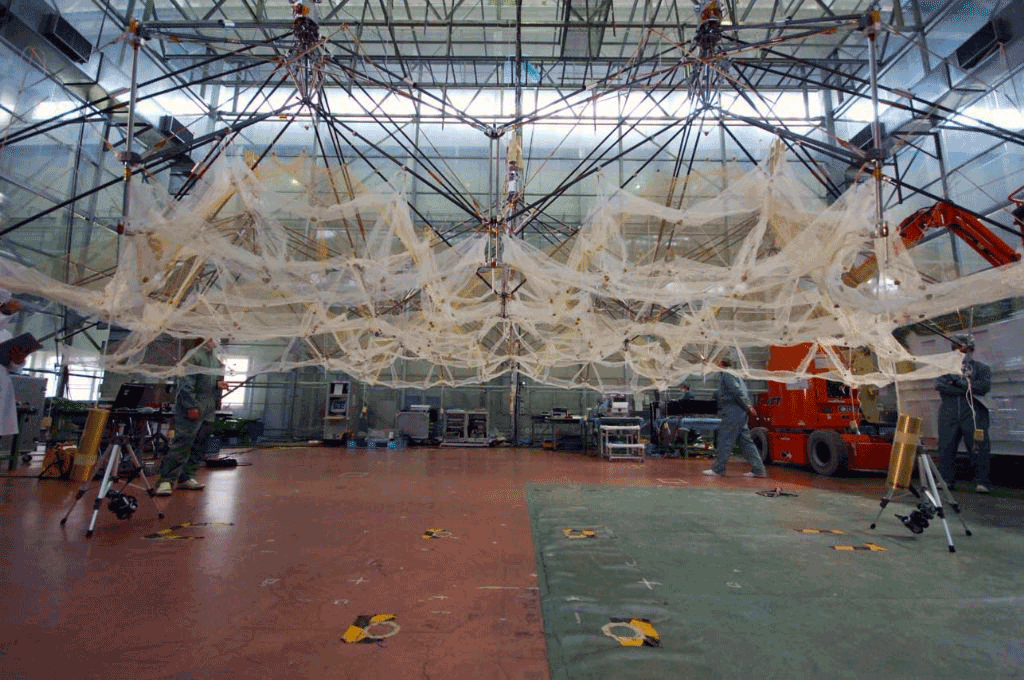KIKU-8 undergoing a mirror-surface deployment test conducted at a specially assembled facility