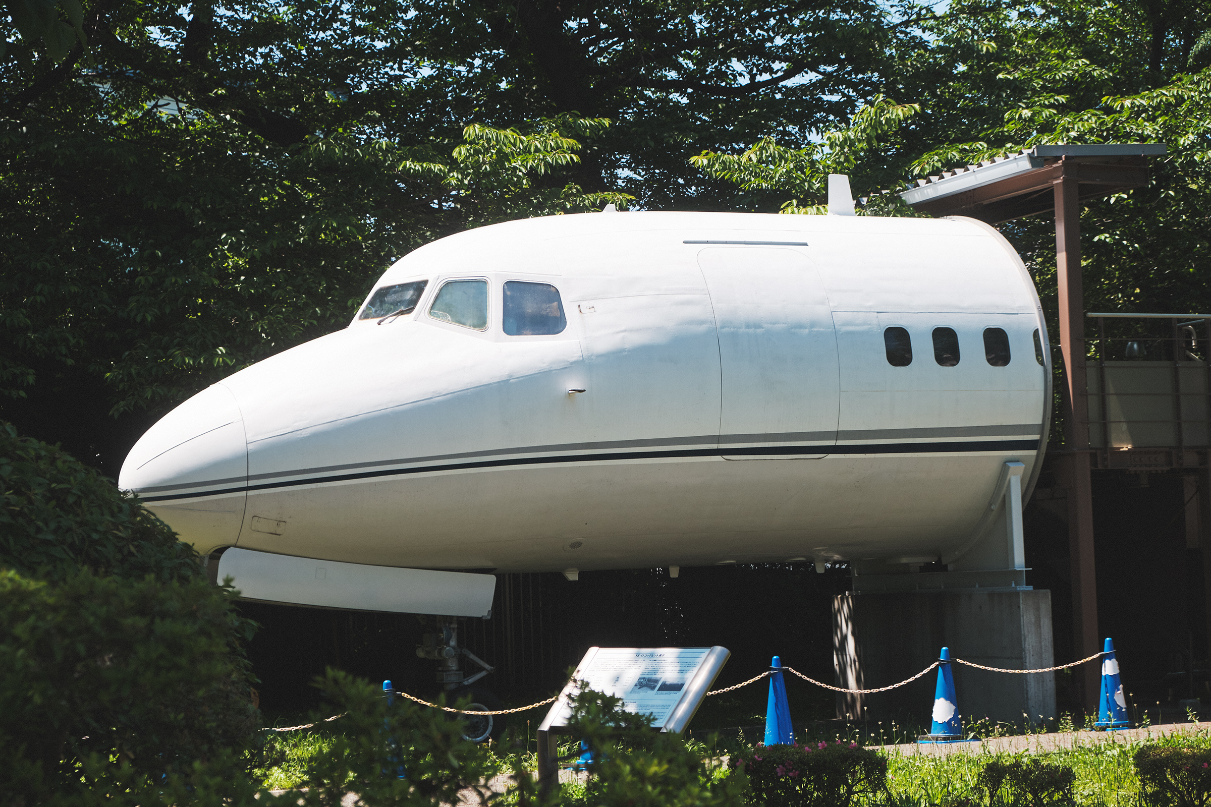 A domestically-produced YS-11 passenger plane on display at the Chofu Aerospace Center visited by Nagaoka; the Center also features an exhibit hall that introduces aerospace research activities