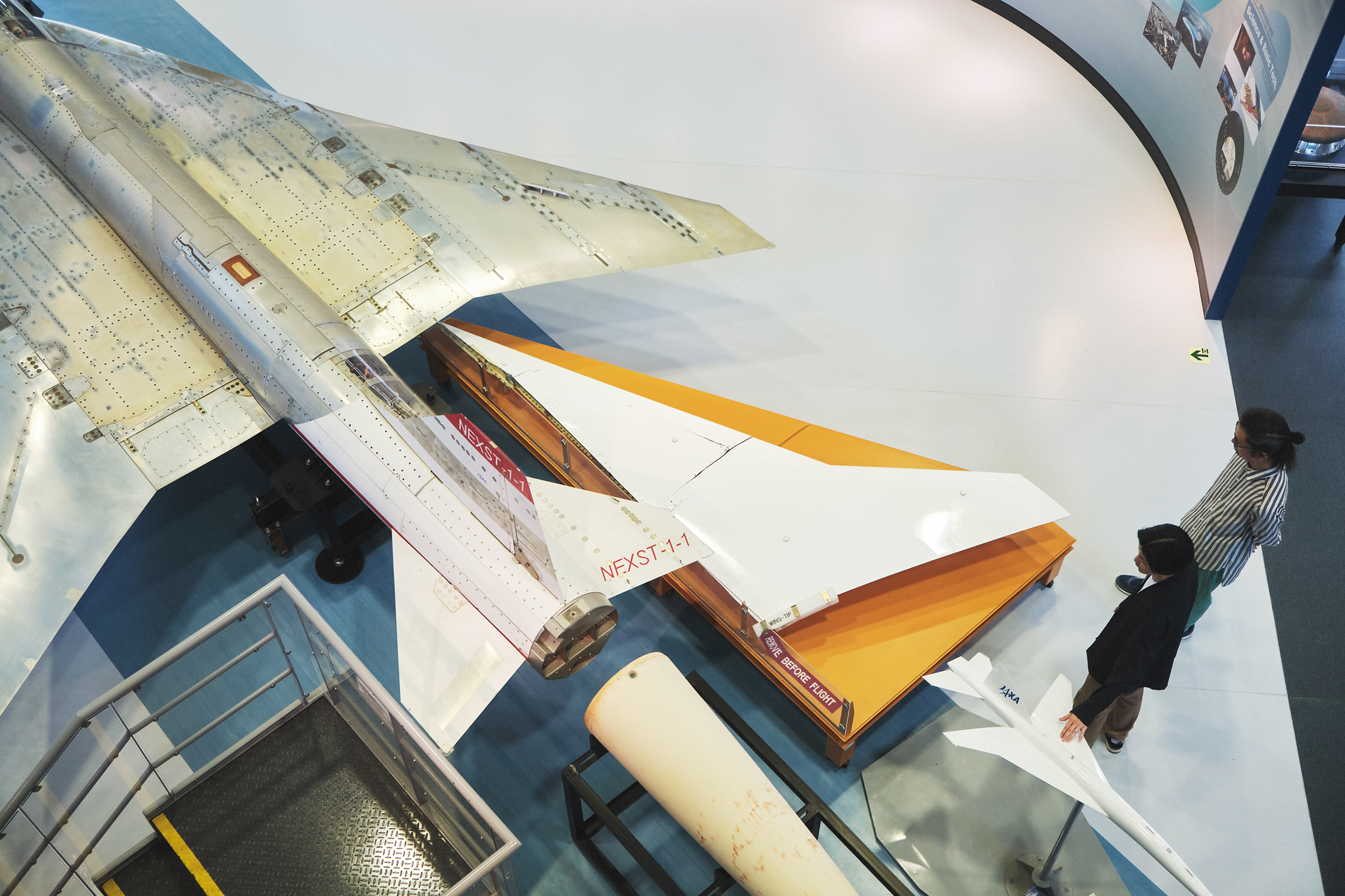 The NEXST-1, a small experimental supersonic aircraft, a model and the right wing of the low-boom concept demonstrator from the D-SEND (Drop test for Simplified Evaluation of Non-symmetrically Distributed sonic boom) project