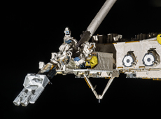 J-SSOD system being moved into place by Kibo&rsquo;s robotic arm (courtesy: JAXA/NASA)