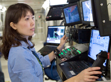 Training using a robotic arm simulator (Courtesy of NASA)