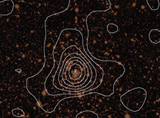 A map of dark matter superimposed on the image of a cluster of galaxies observed by the Subaru Telescope. The image is about seven hundred million light years across. (courtesy: Masahiro Takada (IPMU))
