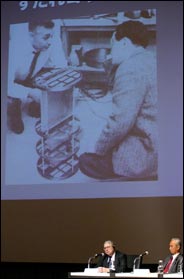 photo of Dr. Giacconi and Dr. Oda looking at the modulation collimator