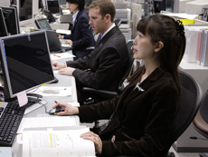 Astronaut Yamazaki supporting the space flight by communicating with STS-123 crewmembers in the Kibo Mission Control Room at the Tsukuba Space Center in Japan.