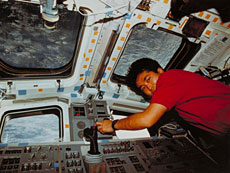 Astronaut Wakata operating the robotic arm on his first flight (STS-72). (Courtesy of NASA)