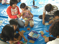 Parents and children making windmills