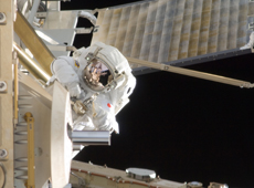 Astronaut Akihiko Hoshide conducting a spacewalk (courtesy: JAXA/NASA)