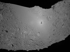 Asteroid Itokawa. In the center of the image is the shadow of HAYABUSA.