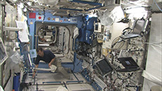 Astronaut Soichi Noguchi working inside Kibo’s Pressurized Module