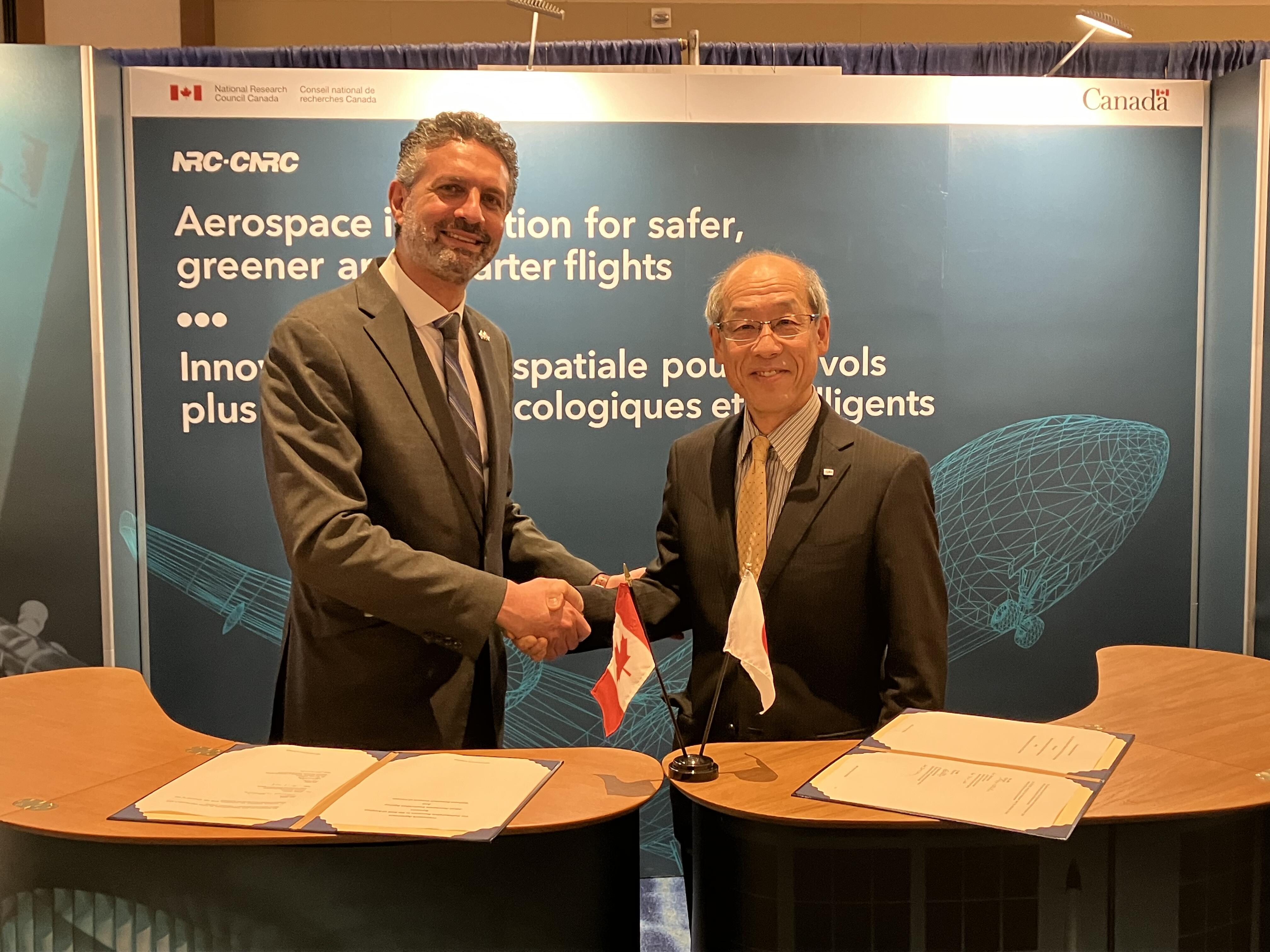 Signing ceremony at AIAA SciTech, January 9, 2024	(Left) Mouhab Meshreki, Director General, Aerospace Research Centre, NRC , and (Right)WATANABE Shigeya, Deputy Director General, Aviation Technology Directorate, JAXA 